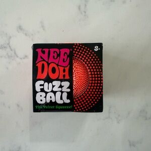 NeeDoh Fuzz Ball in bright orange